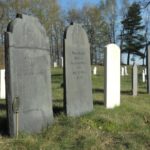 Cemetery stones and green grass